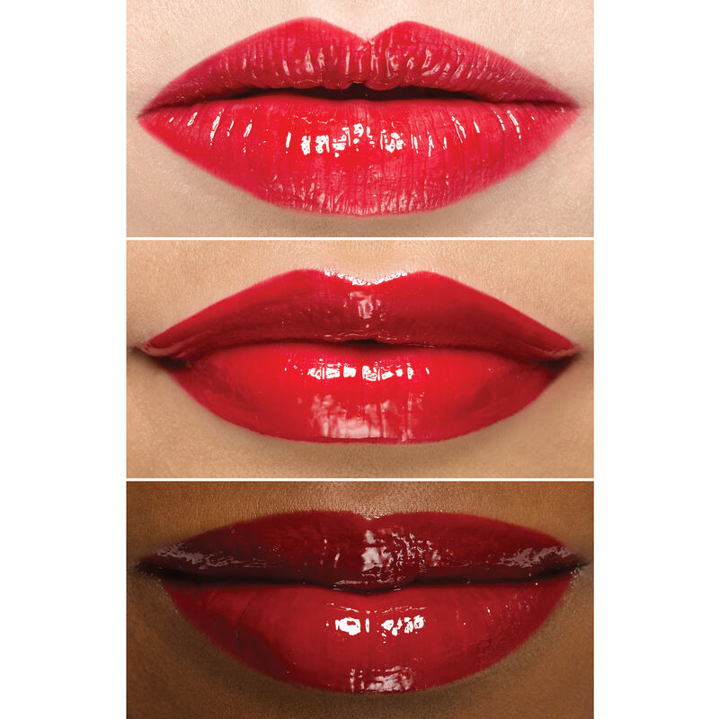 Close up of lips wearing Mary Kay Unlimited Lip Gloss in shade Iconic Red on an ivory, bronze and deep skin tone. image number null