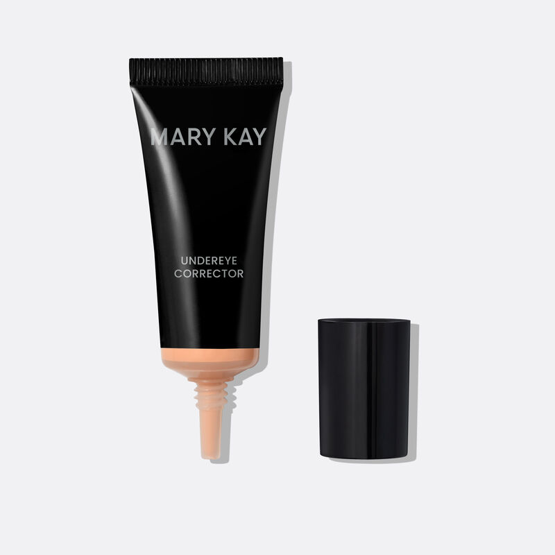 Black Mary Kay&trade; Undereye Corrector Bottle in light peach with the cap removed, showcasing the needle nose