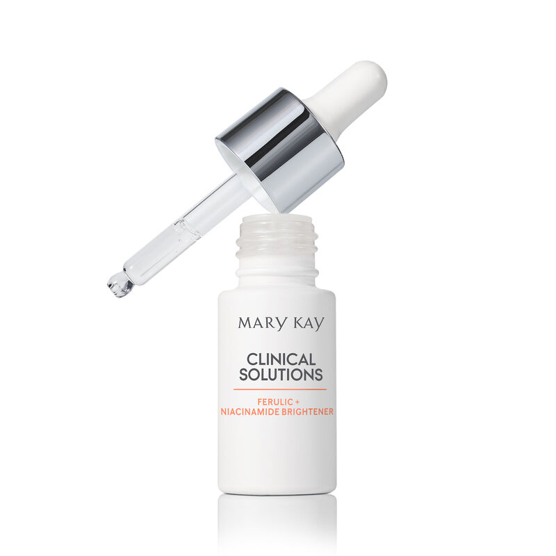 Open bottle of Mary Kay Clinical Solutions Ferulic + Niacinamide Brightener with filled dropper