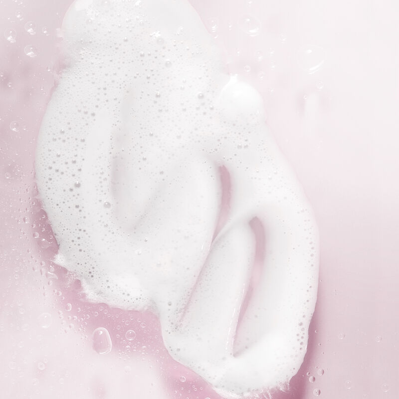 Product rub of lathered Mary Kay Hydrating Cleanser against light pink background