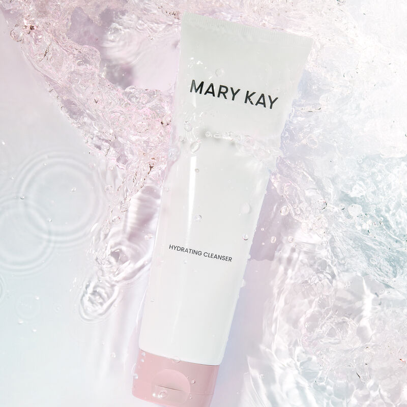Tube of Mary Kay Hydrating Cleanser immersed in water with a slight pink tint
